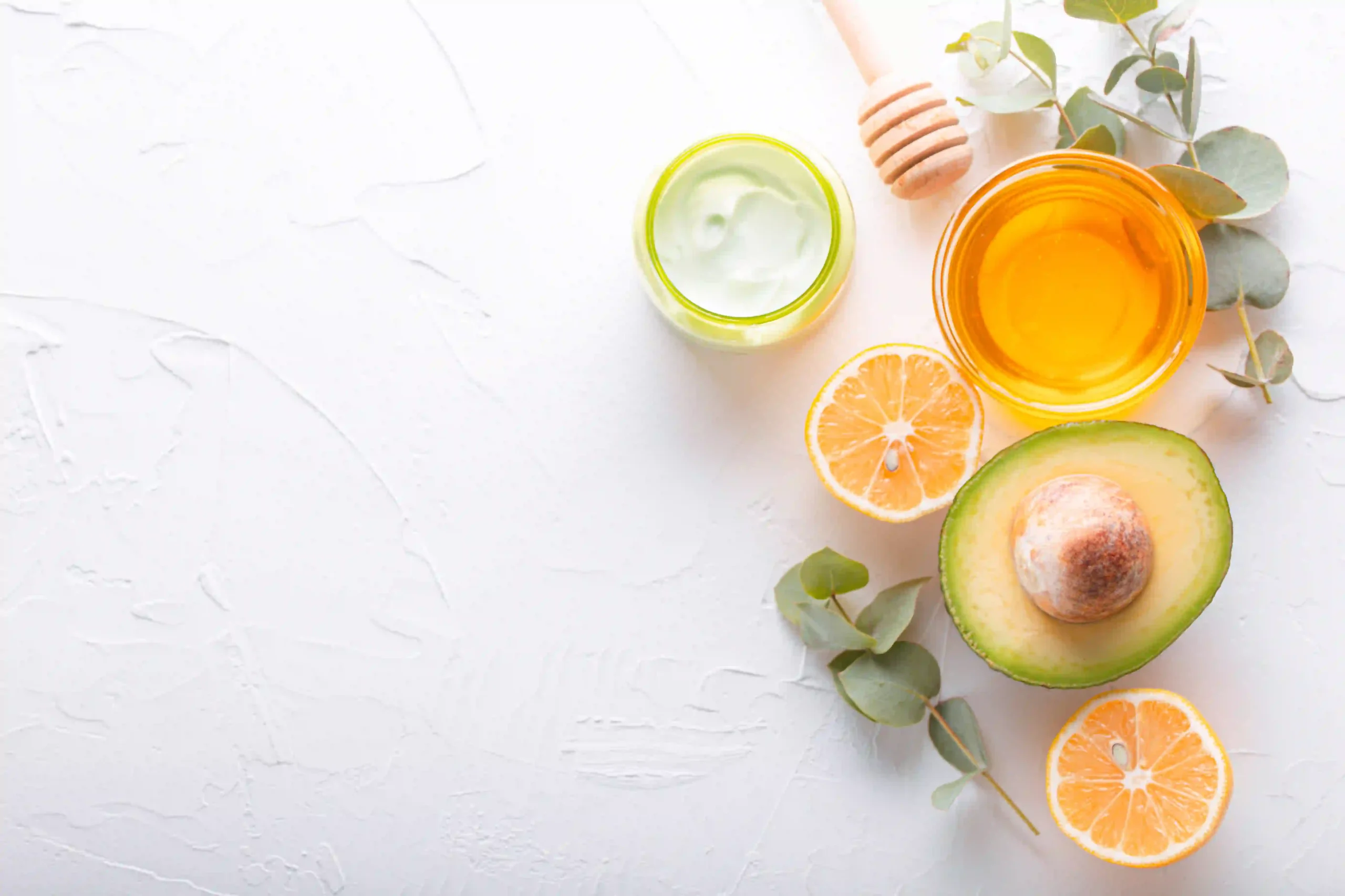 Natural skincare ingredients on white background